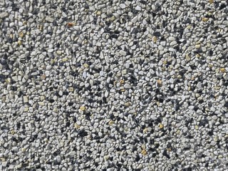 Grit stone background grey gravel (Pebble) floor texture, top view.