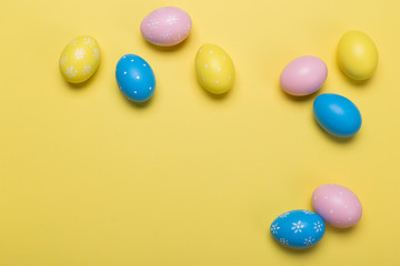 easter eggs on yellow pastel color background with space. Concept