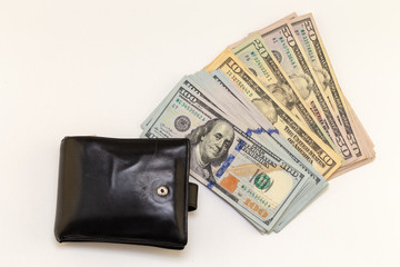 Black wallet, hundred dollar bills on white background with copy space. finance and money background. American Dollars Cash Money. fifty Bucks.