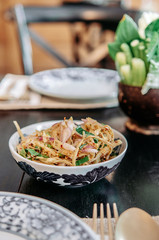 Thai spicy bamboo shoot salad in ceramic bowl