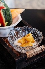 Thai dessert Banana in syrup with coconut milk, close up shot