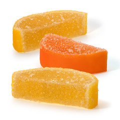 Marmalade candy and in the form of slices of lemon and orange on a white background
