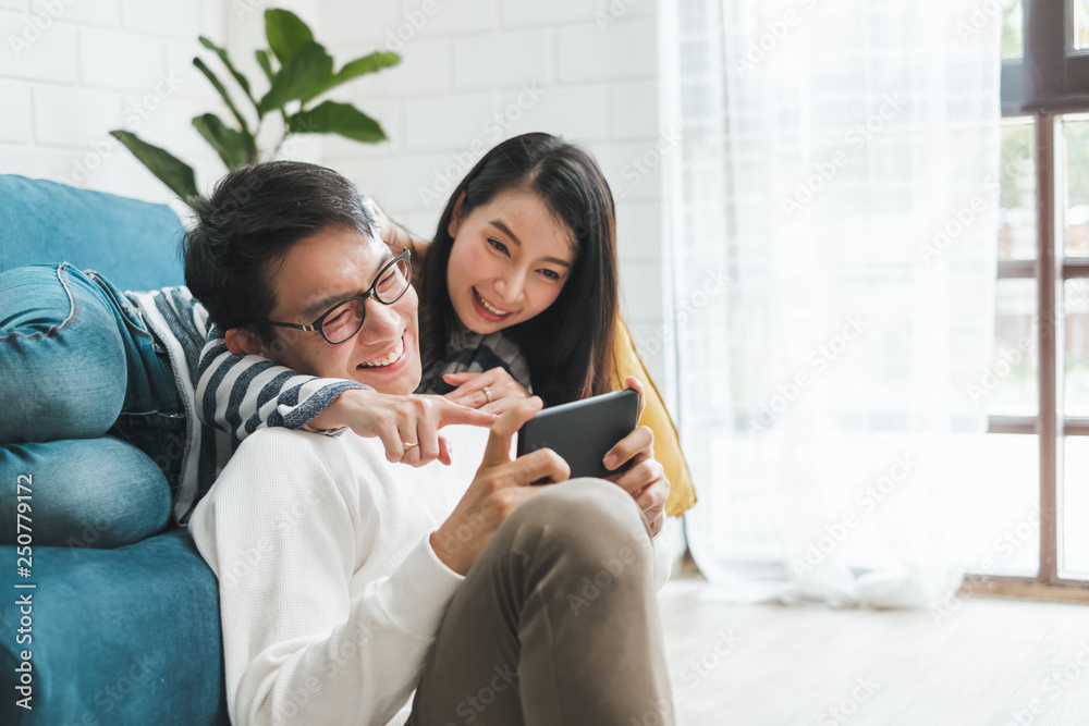 Wall mural lifestyle asian couple man and woman talking working spend time together at home, asian couple famil