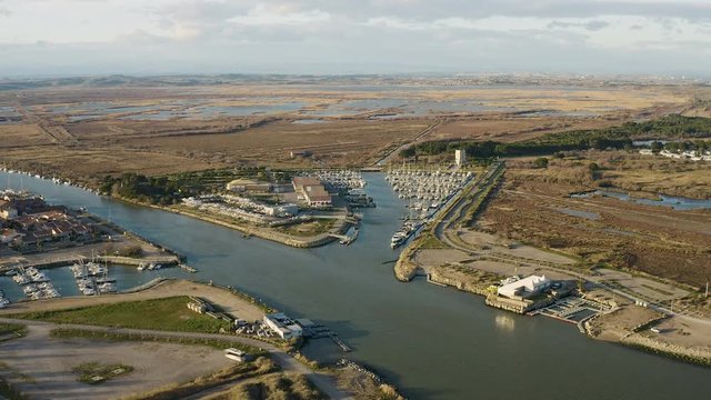 Chichoulet harbor along the river Aude aerial drone view sunset time fishing and sailing port