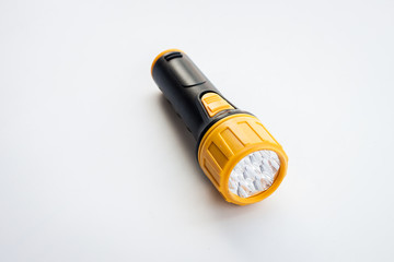 led yellow flash ligth on the white background, isolate emergency tool led handle flashlight