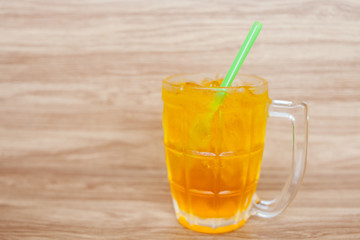 Yellow chrysanthemum tea with ice fresh drink on the wood background 