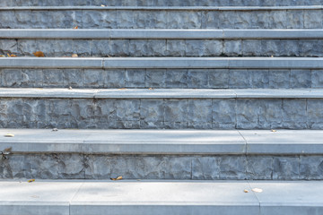 Fototapeta premium Front view of gray steps stair at park.