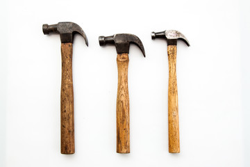 Set of three vintage old hammer on white background, tool for carpenter wood working 