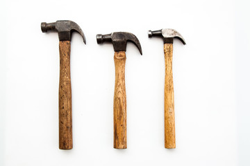 Set of three vintage old hammer on white background, tool for carpenter wood working 