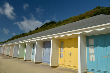 Fototapeta na wymiar Beach huts on seafront at Bournemouth, Dorset