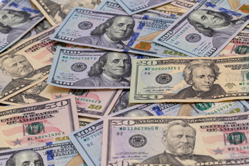 Background of dollar bills. American Dollars Cash Money. One hundred dollars, fifty dollars, ten...