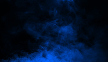 Abstract blue smoke mist fog on a black background. Texture background for graphic and web. © Victor