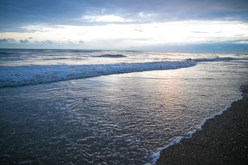 Gloomy outdoor landscape view from seaside with overcast sky clouds