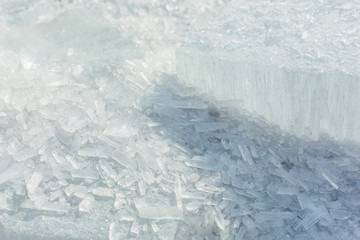 Fototapeta na wymiar Amazing abstract broken ice crystals texture. Clear melting ice background.