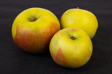 Ripe apples over background