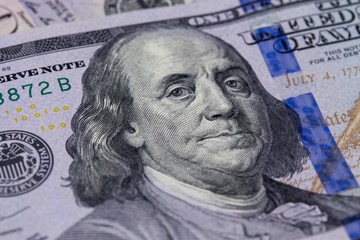 Obraz na płótnie Canvas Closeup of a hundred dollar bill. Background of dollar bills. American Dollars Cash Money. Hundred Bucks. Benjamin Franklin's portrait