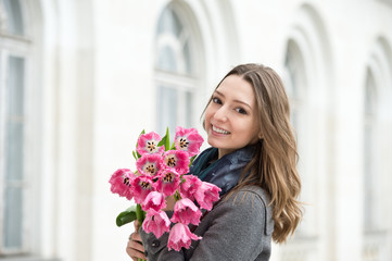 Woman with tulips. Beautiful woman with flowers.