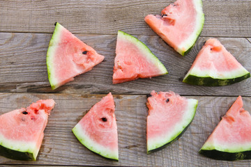 Sliced watermelon on rustic wooden table. Top view
