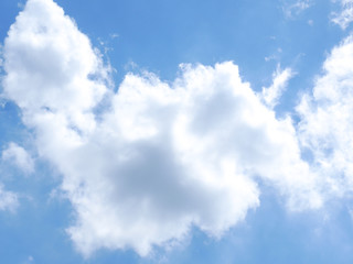 Blue sky background with clouds and sun light.