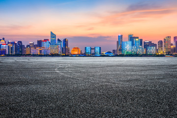 Empty asphalt square ground and Hangzhou business district cityscape
