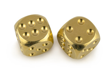 Two golden dices closeup isolated on white background. Six and four, with a shadow.