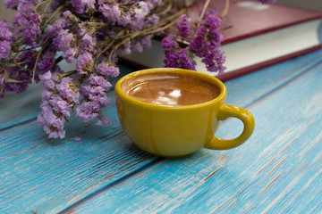 Yellow cup of hot coffee.