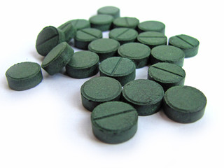 Supplement, spirulina tablets top view.