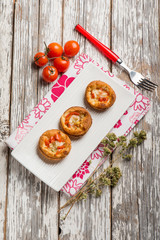 mini pizzas with tomatoes mozzarella and oregano