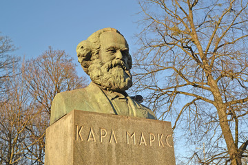KALININGRAD, RUSSIA. Karl Marx's bust in the twilight of spring day. The Russian text - Karl Marx