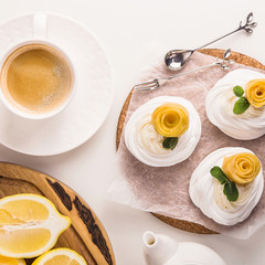 Light festive pavlova dessert made from meringue, lemon kurt and whipped cream
