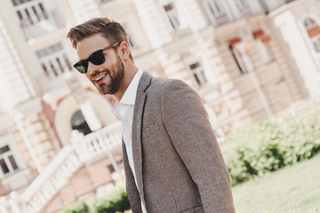 Your limitation - it's only your imagination. Portrait of brown-haired man wearing sunglasses and...