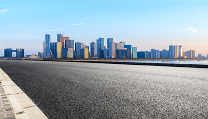 Empty asphalt road through Hangzhou business district