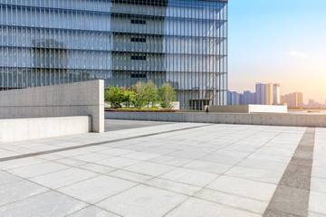 Fototapeta premium Empty square floor and modern commercial building in Hangzhou