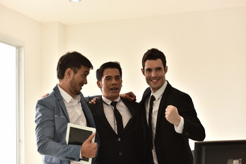 A group of young businessmen are having fun and chatting. And sometimes stressful