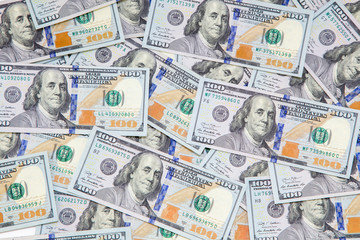 Fototapeta na wymiar Background of dollar bills. American Dollars Cash Money. One Hundred Dollar Banknotes. Hundred Bucks. Benjamin Franklin's portrait