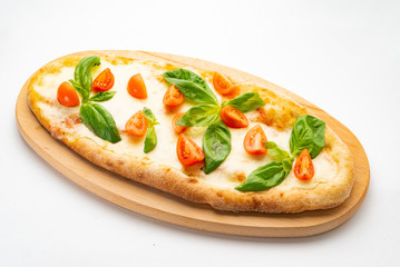 Pizza Margherita on the wooden board. Pizza Margarita with Tomatoes, Basil and Mozzarella Cheese