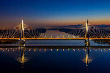 Budapest, Hungary - Aerial view of the illuminated Megyeri Bridge at dusk with clear blue sky