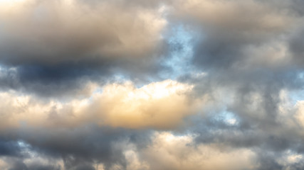 Naklejka na ściany i meble dramatic clouds against the blue sky