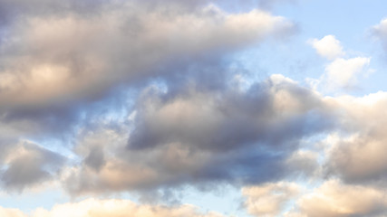dramatic clouds against the blue sky