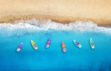 Wall murals Aerial view beach Boats from air. Aerial view on sea in Turkey. Summer seascape with clear water and sandy beach in sunny day. Top view of boats from drone. Summer seascape from air. Travel - image