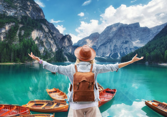 Traveler look at the mountain lake. Travel and active life concept. Adventure and travel in the mountains, .Lago di Braers lake, Dolomite Alps, Italy.