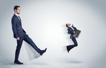 Young businessman fired cruel and aggressive by his boss with white background
