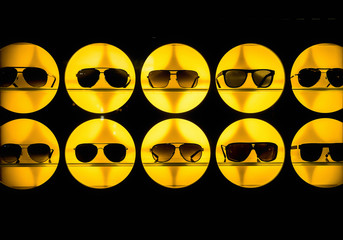 Sunglasses displayed in a yellow show case