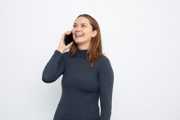 young woman smiling talking in cellphone