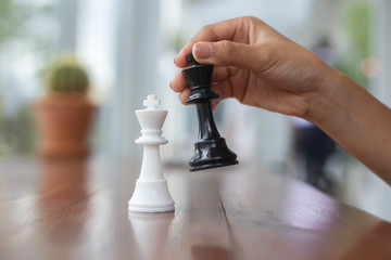 Chess placed on a wooden table,concept : of business strategy and tactic battle,symbol competition...