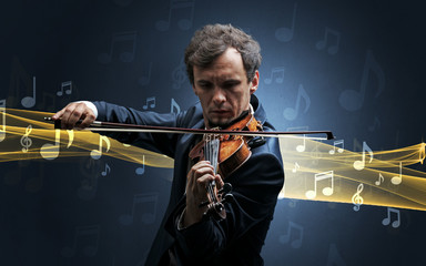 Young male musician playing on his violin with musical notes around
