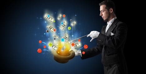 Illusionist conjure with magic wand gambling things from a cylinder