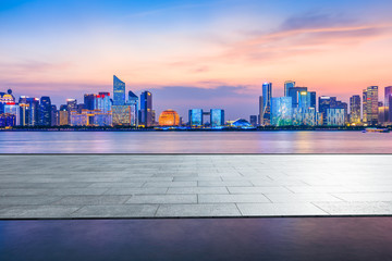 Naklejka na ściany i meble Empty floor platform and beautiful city night view in Hangzhou