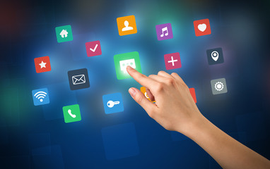 Female hand touching colorful applications 