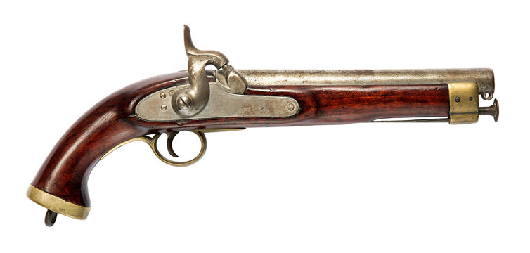 Old hand gun with wooden handle on white